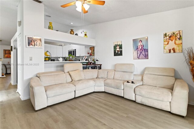 17320 NW 66th Pl, Hialeah, FL 33015 - living room featuring light wood finished floors, ceiling fan, and high vaulted ceiling