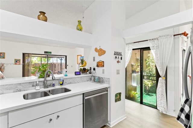 17320 NW 66th Pl, Hialeah, FL 33015 - kitchen with dishwasher, a sink, light countertops, plenty of natural light, and a high ceiling