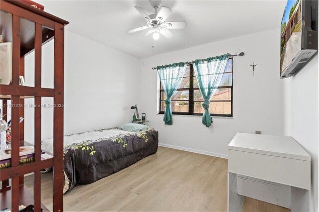 17320 NW 66th Pl, Hialeah, FL 33015 - bedroom featuring light wood-type flooring and baseboards
