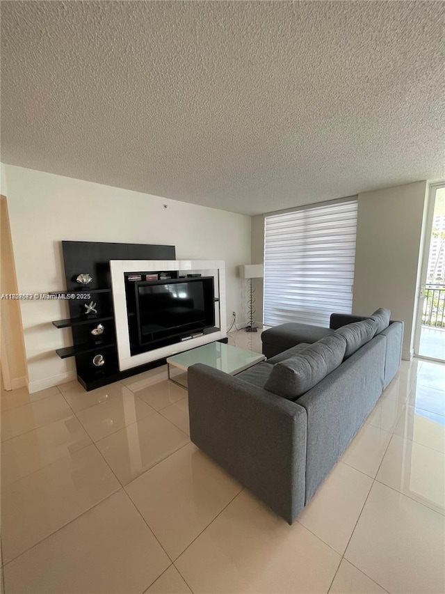 17555 Atlantic Blvd Unit 702, Sunny Isles Beach, FL 33160 - living room featuring a textured ceiling and tile patterned floors
