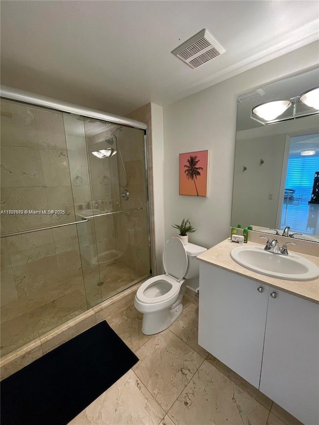 17555 Atlantic Blvd Unit 702, Sunny Isles Beach, FL 33160 - bathroom featuring a stall shower, toilet, vanity, and marble look tiles