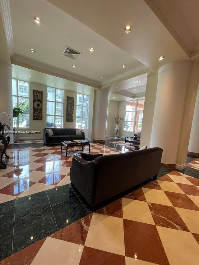 17555 Atlantic Blvd Unit 702, Sunny Isles Beach, FL 33160 - living area with crown molding, ornate columns, a tray ceiling, baseboards, and recessed lighting