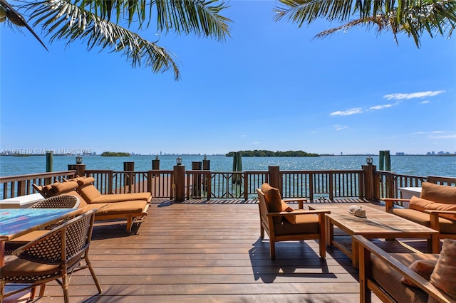 5725 N Bayshore Dr, Miami, FL 33137 - wooden deck featuring a water view and outdoor lounge area