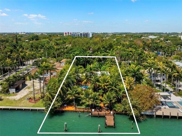 5725 N Bayshore Dr, Miami, FL 33137 - aerial view of property and surrounding area featuring property boundaries highlighted, a large body of water, and a tree filled landscape