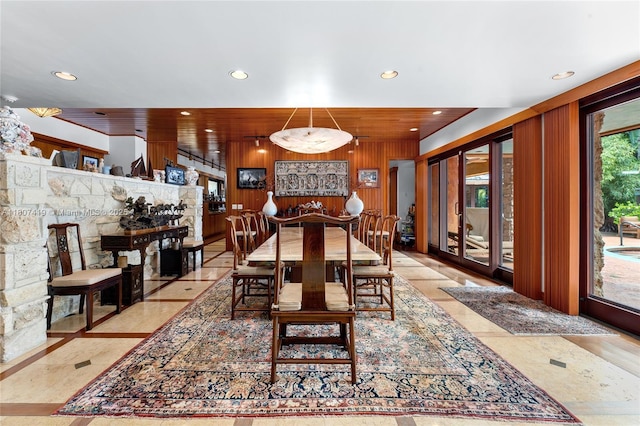 5725 N Bayshore Dr, Miami, FL 33137 - dining room featuring recessed lighting, inlaid floor details, and wood walls