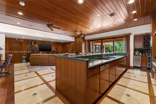5725 N Bayshore Dr, Miami, FL 33137 - kitchen with inlaid floor details, wood ceiling, recessed lighting, dishwasher, and fridge