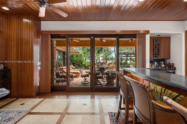 5725 N Bayshore Dr, Miami, FL 33137 - doorway to outside featuring a ceiling fan, a dry bar, wooden ceiling, recessed lighting, and wooden walls