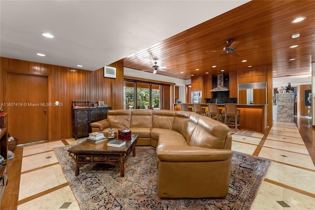5725 N Bayshore Dr, Miami, FL 33137 - living area with inlaid floor details, recessed lighting, ceiling fan, and wood walls