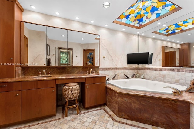 5725 N Bayshore Dr, Miami, FL 33137 - bathroom featuring a garden tub, inlaid floor details, double vanity, recessed lighting, and tile patterned floors