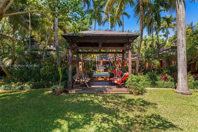 5725 N Bayshore Dr, Miami, FL 33137 - view of grassy yard with a gazebo and a wooden deck