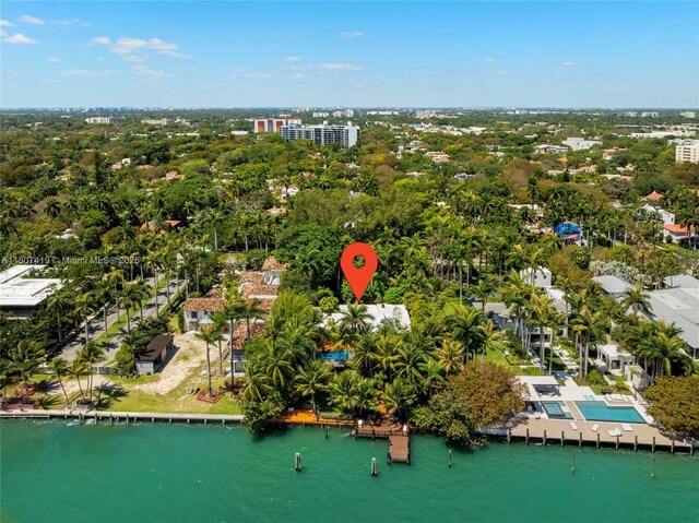 5725 N Bayshore Dr, Miami, FL 33137 - drone / aerial view of a nearby body of water, a tree filled landscape, and a pool area