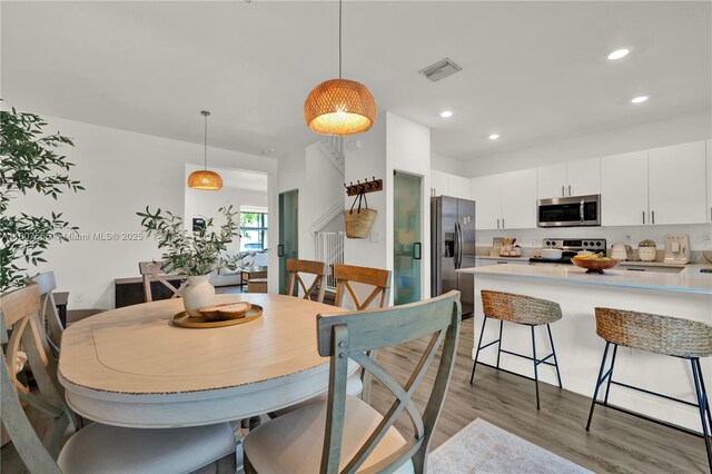 12982 SW 232nd Ln, Miami, FL 33170 - dining area featuring light wood-type flooring and recessed lighting