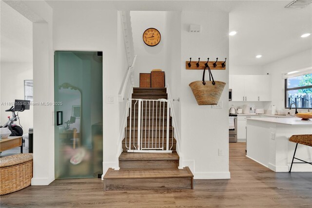 12982 SW 232nd Ln, Miami, FL 33170 - stairs with wood finished floors and recessed lighting