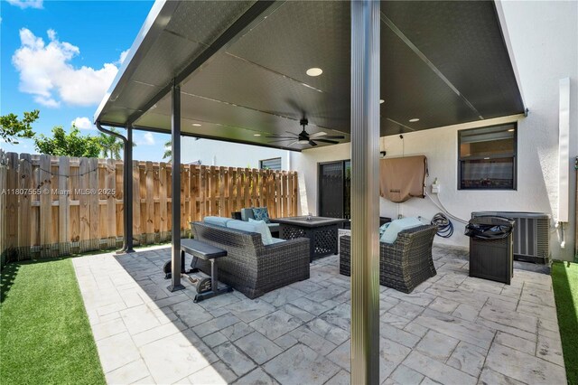 12982 SW 232nd Ln, Miami, FL 33170 - view of patio featuring an outdoor living space with a fire pit, a ceiling fan, and central air condition unit