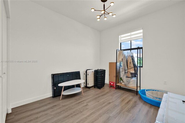 12982 SW 232nd Ln, Miami, FL 33170 - sitting room featuring a chandelier, wood finished floors, and baseboards