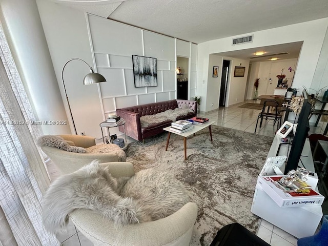 900 Bay Dr Unit 211, Miami Beach, FL 33141 - living area featuring tile patterned flooring