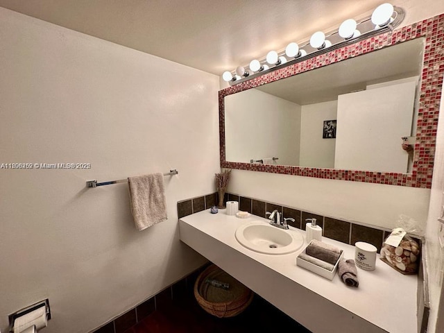 900 Bay Dr Unit 211, Miami Beach, FL 33141 - bathroom featuring backsplash and vanity