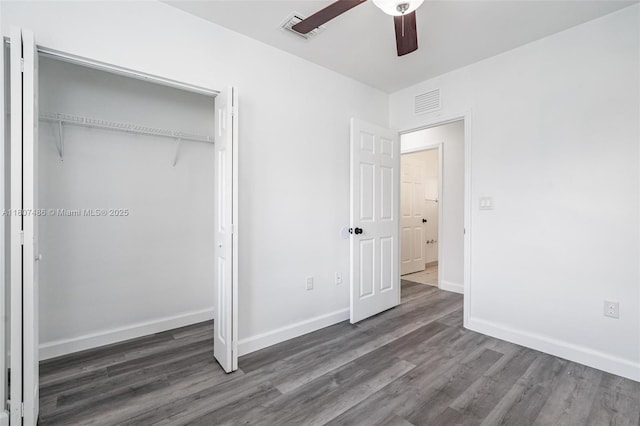1402 E River Dr, Margate, FL 33063 - unfurnished bedroom featuring wood finished floors, a closet, baseboards, and a ceiling fan