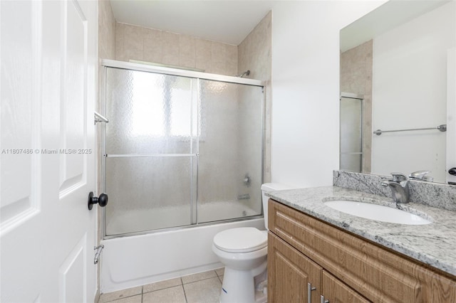 1402 E River Dr, Margate, FL 33063 - bathroom with tile patterned flooring, vanity, enclosed tub / shower combo, and toilet