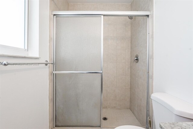 1402 E River Dr, Margate, FL 33063 - bathroom with a stall shower and toilet