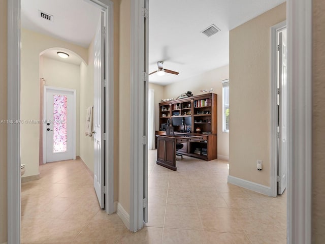 19165 N Gardenia Ave, Weston, FL 33332 - corridor featuring arched walkways, light tile patterned flooring, and baseboards