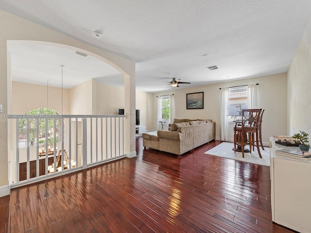 19165 N Gardenia Ave, Weston, FL 33332 - living room with ceiling fan, arched walkways, wood-type flooring, and baseboards