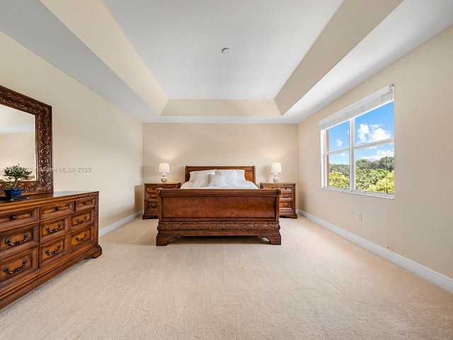 19165 N Gardenia Ave, Weston, FL 33332 - bedroom featuring baseboards, light carpet, and a tray ceiling