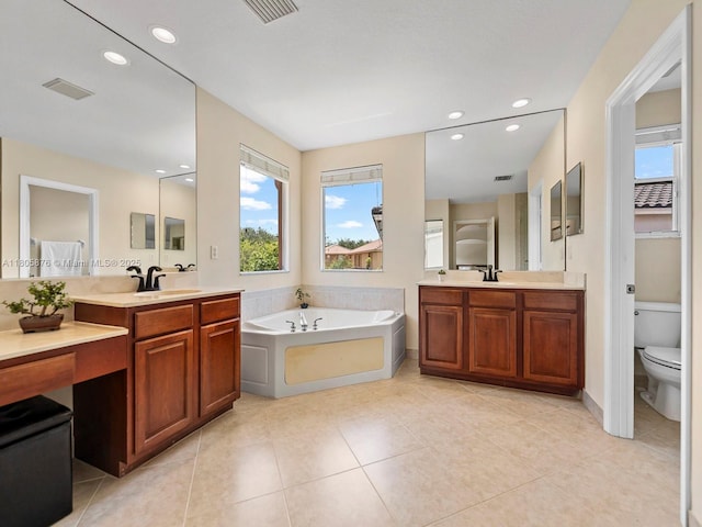 19165 N Gardenia Ave, Weston, FL 33332 - bathroom with toilet, a garden tub, recessed lighting, tile patterned flooring, and two vanities