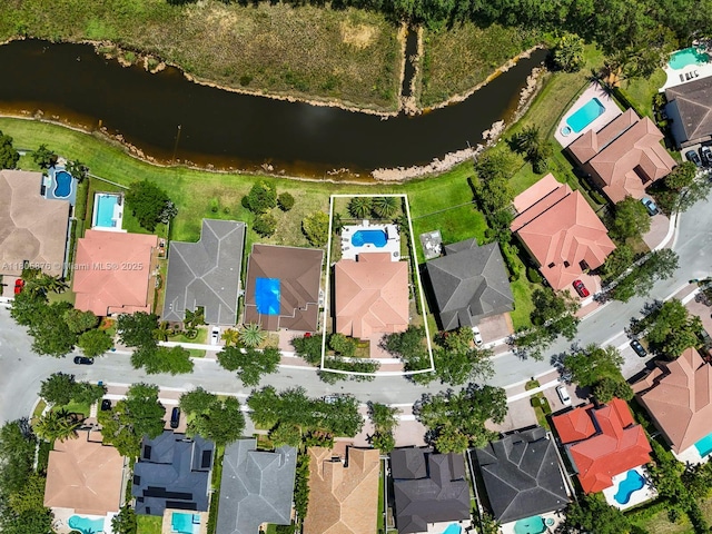 19165 N Gardenia Ave, Weston, FL 33332 - aerial view of property's location with nearby suburban area, a nearby body of water, property boundaries highlighted, and a pool area