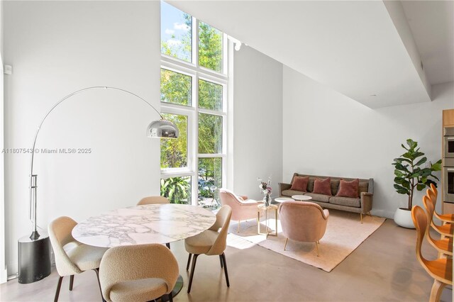 455 NE 39th St Unit 102, Miami, FL 33137 - dining room with plenty of natural light and a high ceiling