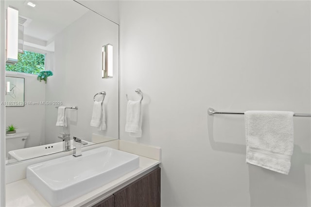 455 NE 39th St Unit 102, Miami, FL 33137 - bathroom with toilet and vanity