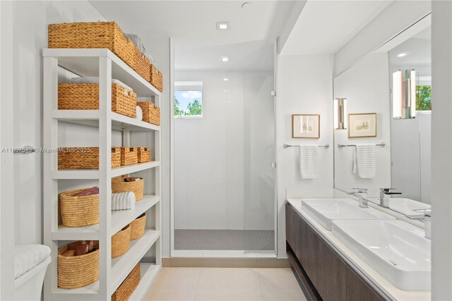455 NE 39th St Unit 102, Miami, FL 33137 - bathroom featuring a shower stall, tile patterned flooring, double vanity, and toilet