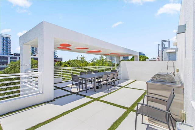 455 NE 39th St Unit 102, Miami, FL 33137 - view of patio with outdoor dining area