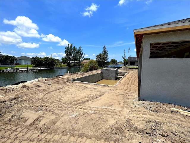 520 SW 28th St, Cape Coral, FL 33914 - view of yard featuring a water view