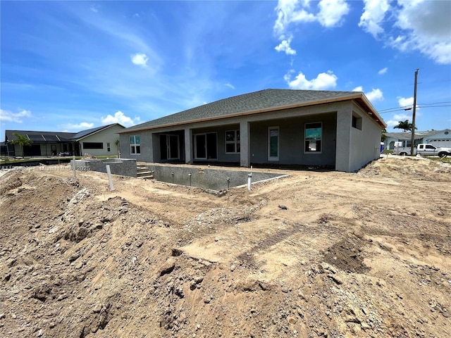520 SW 28th St, Cape Coral, FL 33914 - back of house featuring stucco siding