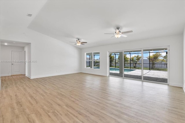 520 SW 28th St, Cape Coral, FL 33914 - empty room featuring ceiling fan, light wood-style flooring, and vaulted ceiling