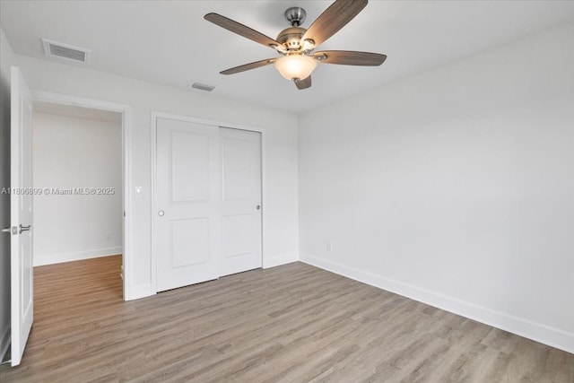 520 SW 28th St, Cape Coral, FL 33914 - unfurnished bedroom featuring light wood-style floors, a closet, and ceiling fan