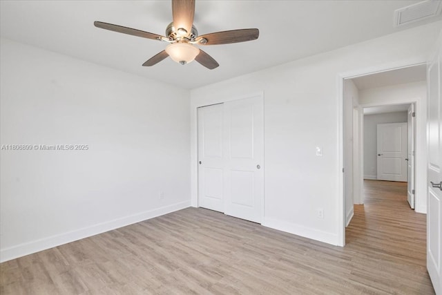 520 SW 28th St, Cape Coral, FL 33914 - unfurnished bedroom featuring light wood-style floors, a closet, and ceiling fan