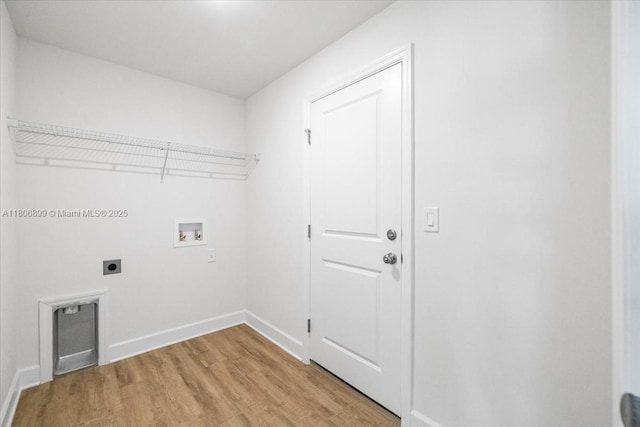 520 SW 28th St, Cape Coral, FL 33914 - laundry area featuring electric dryer hookup, hookup for a washing machine, and light wood-style flooring