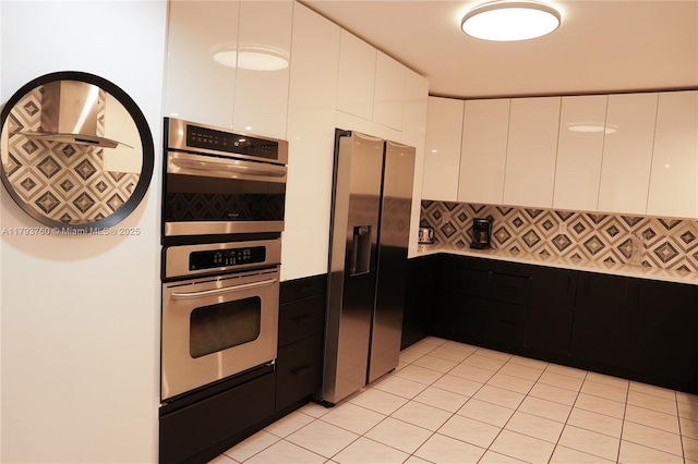500 Three Islands Blvd Unit 106, Hallandale Beach, FL 33009 - kitchen with appliances with stainless steel finishes, modern cabinets, white cabinetry, and tasteful backsplash