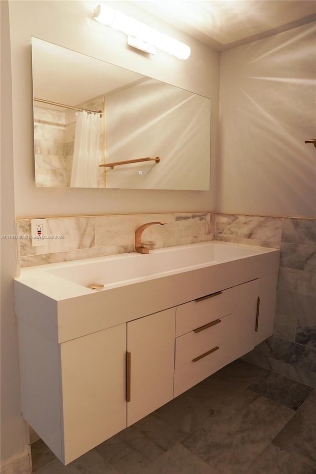 500 Three Islands Blvd Unit 106, Hallandale Beach, FL 33009 - full bathroom with tile walls, vanity, and curtained shower