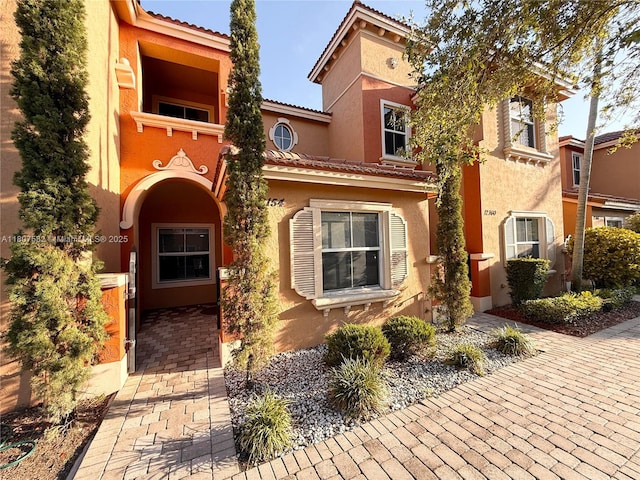 12154 SW 27th St Unit 1102, Miramar, FL 33025 - view of front of home featuring stucco siding and a tiled roof