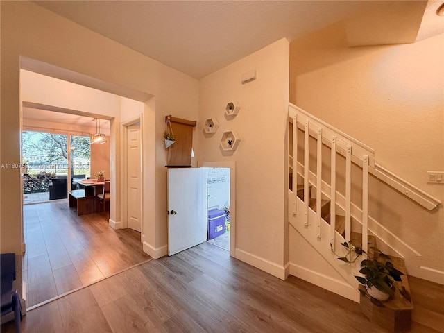 12154 SW 27th St Unit 1102, Miramar, FL 33025 - stairs featuring wood finished floors and baseboards