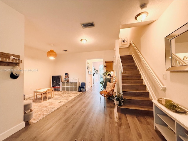 12154 SW 27th St Unit 1102, Miramar, FL 33025 - stairway with wood finished floors and baseboards