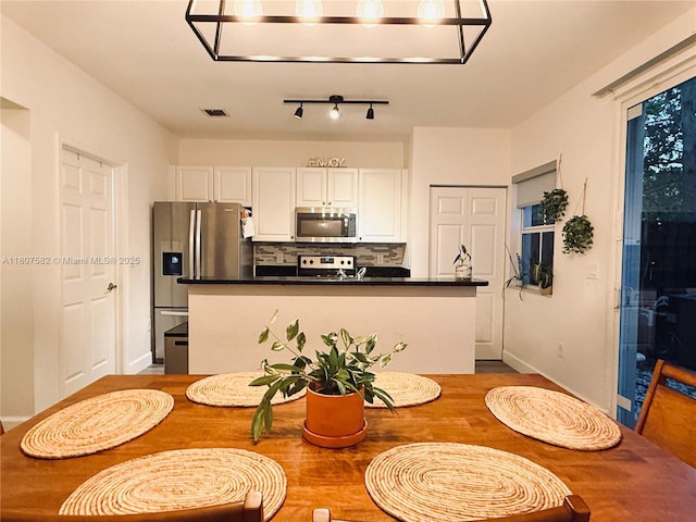 12154 SW 27th St Unit 1102, Miramar, FL 33025 - dining room with baseboards