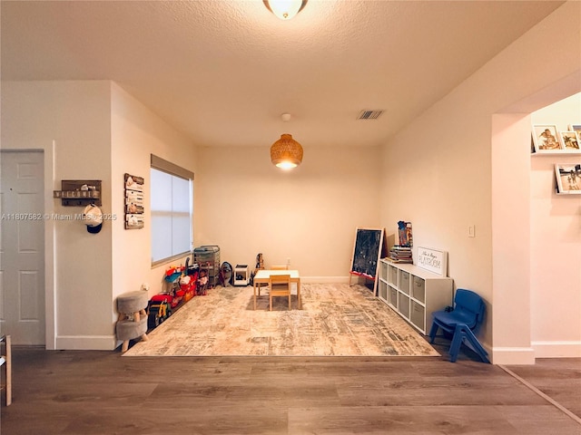 12154 SW 27th St Unit 1102, Miramar, FL 33025 - game room featuring wood finished floors and baseboards