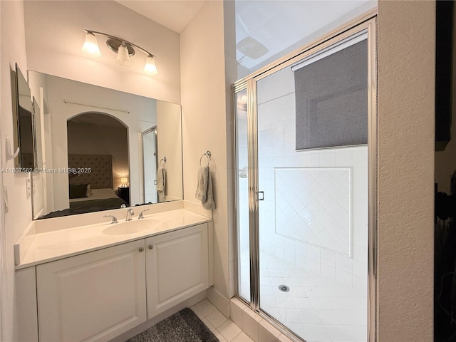 12154 SW 27th St Unit 1102, Miramar, FL 33025 - ensuite bathroom featuring vanity, a stall shower, and tile patterned floors