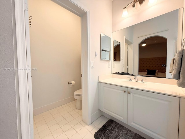 12154 SW 27th St Unit 1102, Miramar, FL 33025 - bathroom featuring vanity, toilet, tile patterned flooring, and baseboards