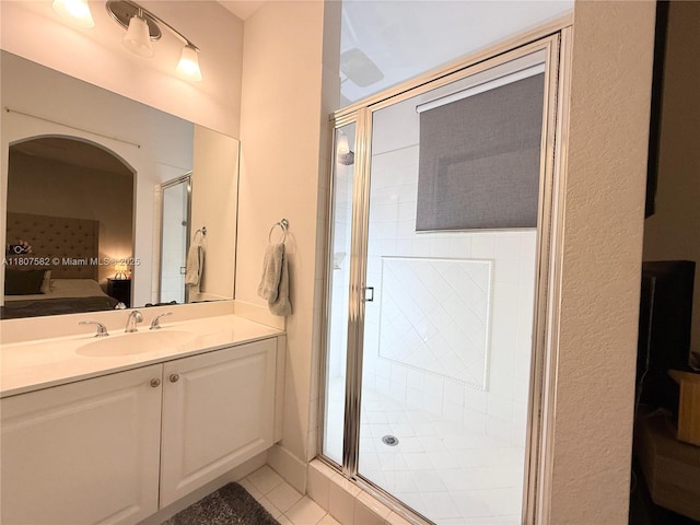 12154 SW 27th St Unit 1102, Miramar, FL 33025 - bathroom with ensuite bathroom, a shower stall, vanity, and tile patterned flooring