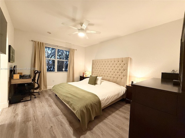 12154 SW 27th St Unit 1102, Miramar, FL 33025 - bedroom with light wood-type flooring, a desk, ceiling fan, and baseboards